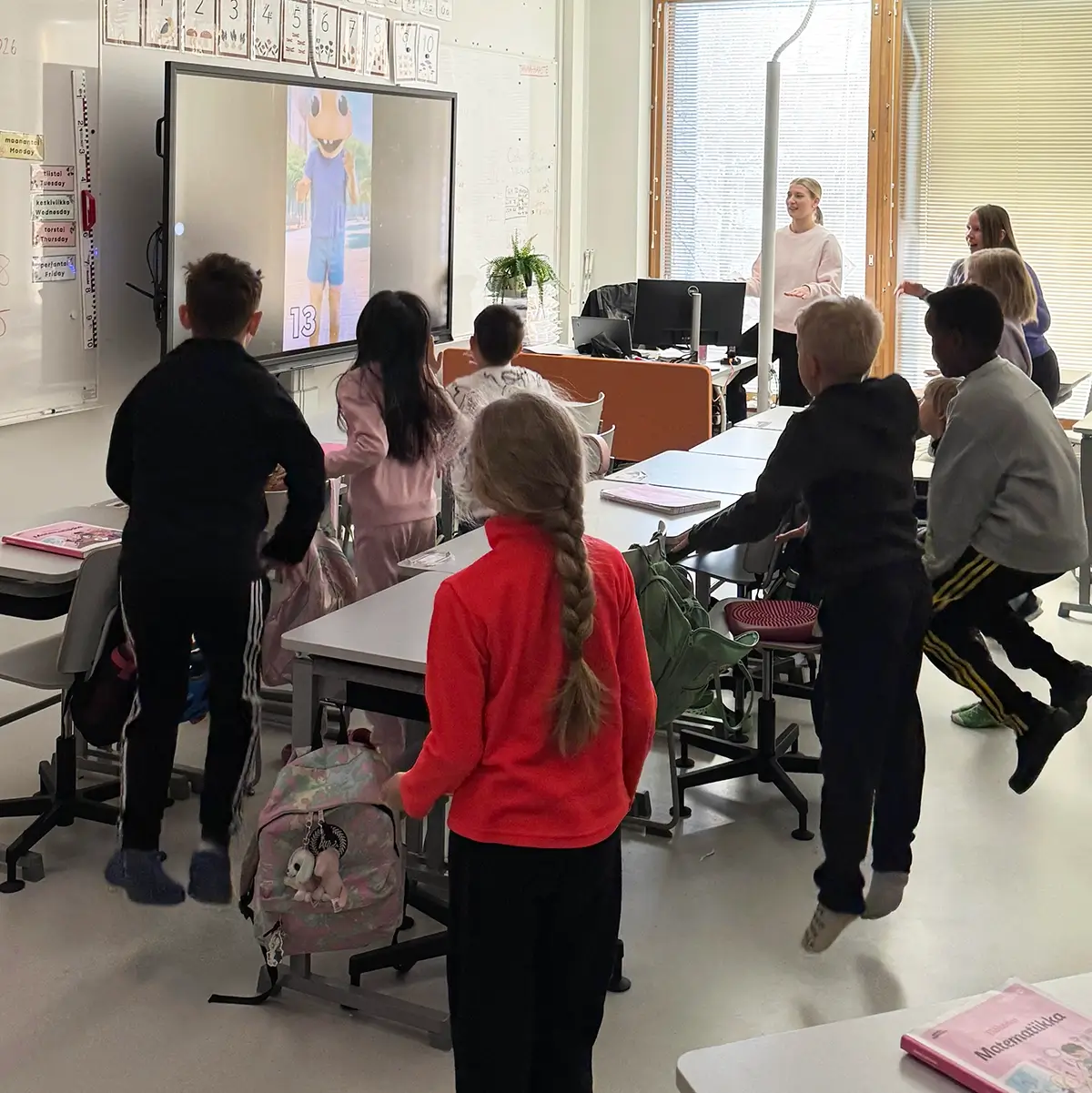 Teacher guiding a Geego movement session in a Finnish classroom