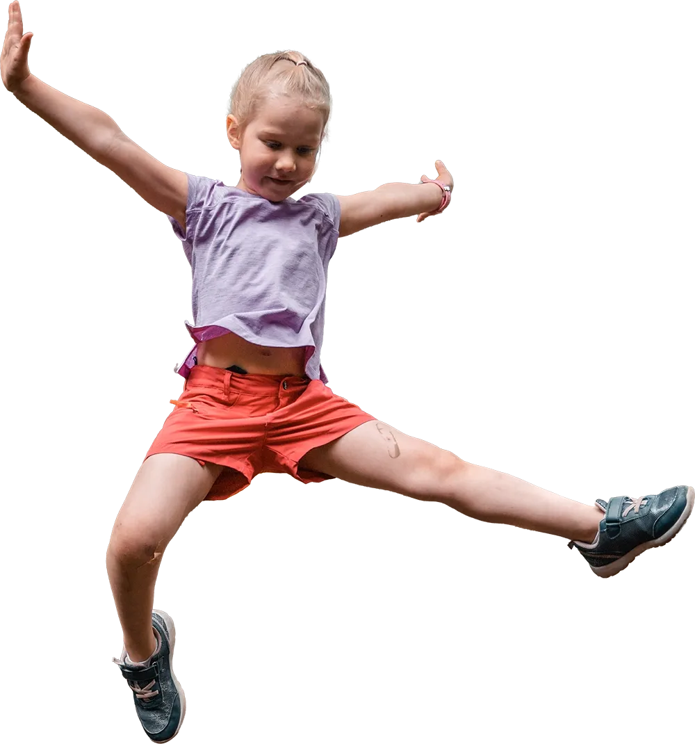 Child jumping joyfully in motion
