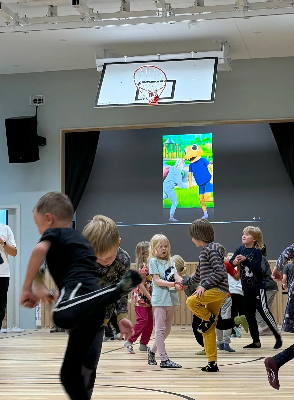 Children learning and moving together in a classroom